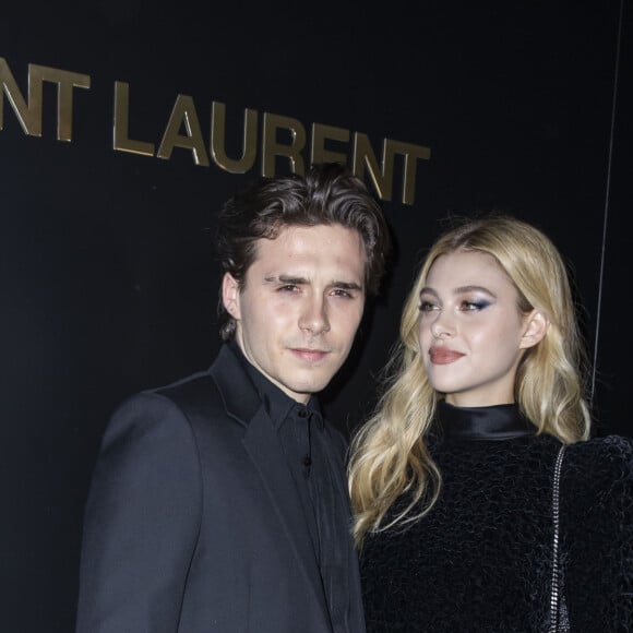 Brooklyn Beckham et Nicola Peltz assistent au défilé de mode Saint Laurent, collection prêt-à-porter automne-hiver 2020/2021, à la Tour Eiffel. Paris, le 25 février 2020. © Olivier Borde / Bestimage