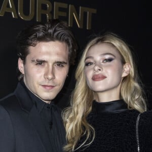 Brooklyn Beckham et Nicola Peltz assistent au défilé de mode Saint Laurent, collection prêt-à-porter automne-hiver 2020/2021, à la Tour Eiffel. Paris, le 25 février 2020. © Olivier Borde / Bestimage