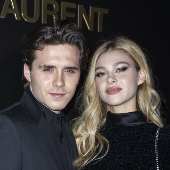 Brooklyn Beckham et Nicola Peltz assistent au défilé de mode Saint Laurent, collection prêt-à-porter automne-hiver 2020/2021, à la Tour Eiffel. Paris, le 25 février 2020. © Olivier Borde / Bestimage