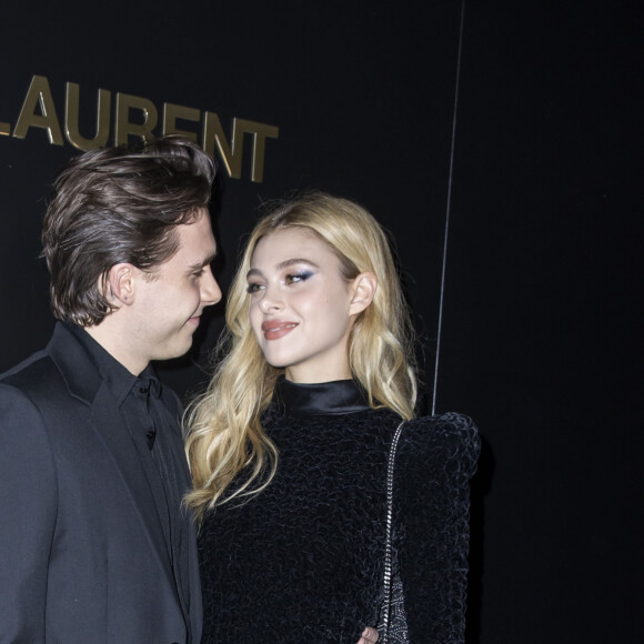 Brooklyn Beckham et Nicola Peltz assistent au défilé de mode Saint Laurent, collection prêt-à-porter automne-hiver 2020/2021, à la Tour Eiffel. Paris, le 25 février 2020. © Olivier Borde / Bestimage