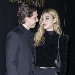 Brooklyn Beckham et Nicola Peltz assistent au défilé de mode Saint Laurent, collection prêt-à-porter automne-hiver 2020/2021, à la Tour Eiffel. Paris, le 25 février 2020. © Olivier Borde / Bestimage