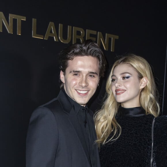 Brooklyn Beckham et Nicola Peltz assistent au défilé de mode Saint Laurent, collection prêt-à-porter automne-hiver 2020/2021, à la Tour Eiffel. Paris, le 25 février 2020. © Olivier Borde / Bestimage