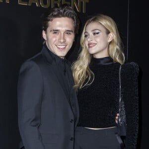 Brooklyn Beckham et Nicola Peltz assistent au défilé de mode Saint Laurent, collection prêt-à-porter automne-hiver 2020/2021, à la Tour Eiffel. Paris, le 25 février 2020. © Olivier Borde / Bestimage