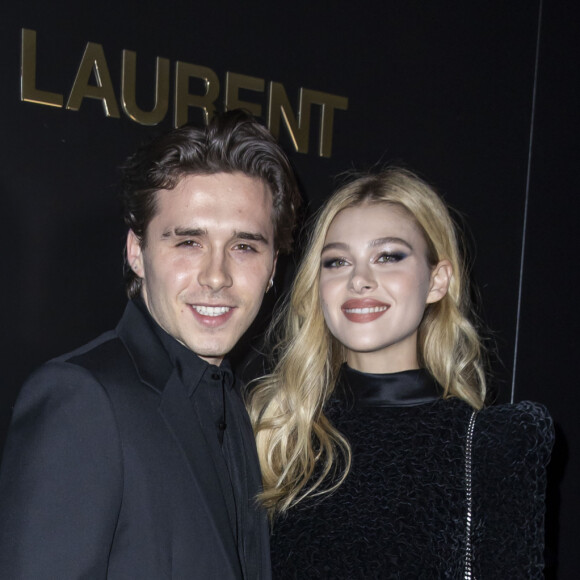 Brooklyn Beckham et Nicola Peltz assistent au défilé de mode Saint Laurent, collection prêt-à-porter automne-hiver 2020/2021, à la Tour Eiffel. Paris, le 25 février 2020. © Olivier Borde / Bestimage