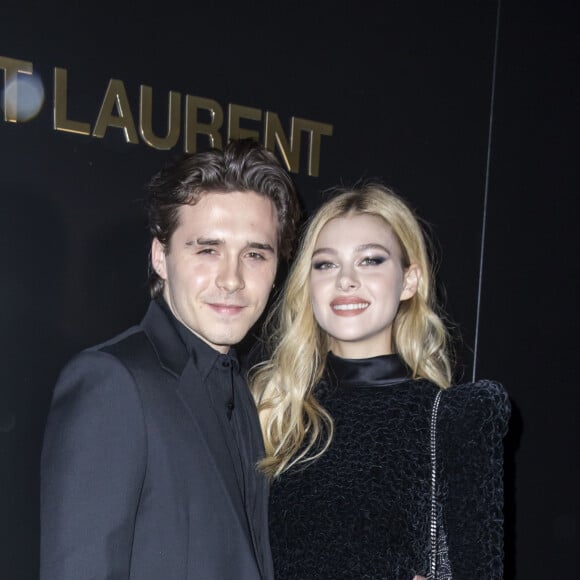 Brooklyn Beckham et Nicola Peltz assistent au défilé de mode Saint Laurent, collection prêt-à-porter automne-hiver 2020/2021, à la Tour Eiffel. Paris, le 25 février 2020. © Olivier Borde / Bestimage