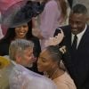 Idris Elba et Sabrina Dhowre avec Serena Williams et George Clooney et sa femme Amal au mariage du prince Harry et de Meghan Markle le 19 mai 2018 à Windsor.