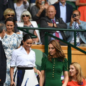 Catherine (Kate) Middleton, duchesse de Cambridge, Meghan Markle, duchesse de Sussex, et Pippa Middleton dans les tribunes lors de la finale femme de Wimbledon "Serena Williams - Simona Halep (2/6 - 2/6) à Londres, le 13 juillet 2019.