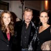 Johnny Hallyday entouré de sa fille Laura Smet et de sa femme Laeticia Hallyday en 2008 lors du vernissage de l'exposition Images et Mode de Patrick Demarchelier au Petit Palais à Paris.