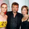 Johnny Hallyday avec sa femme Laeticia Hallyday et sa fille Laura Smet en 203 à L'Amnesia.