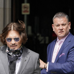 Johnny Depp à son arrivée à la cour royale de justice à Londres, pour le procès en diffamation contre le magazine The Sun Newspaper à Londres, le 23 juillet 2020.