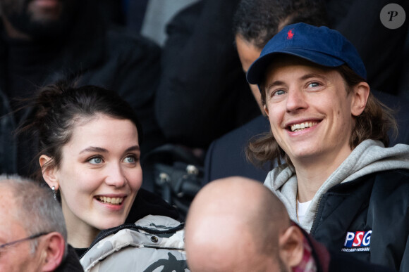 Pierre Sarkozy et une amie dans les tribunes lors du match de Ligue 1 "PSG - Dijon (4-0)" au Parc des Princes, le 29 février 2020. © Cyril Moreau/Bestimage