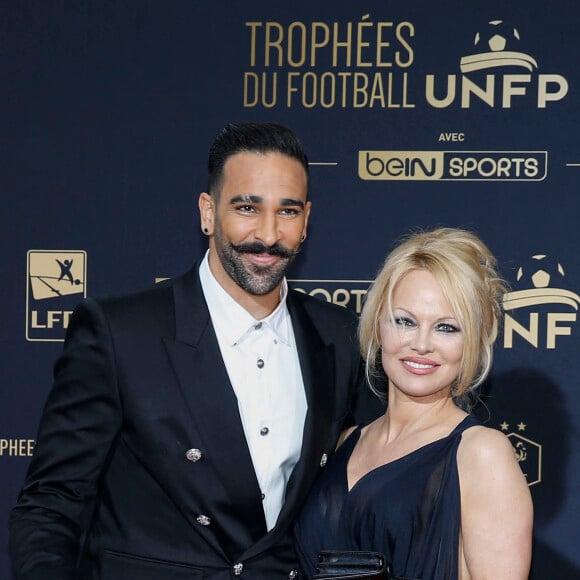 Adil Rami et Pamela Anderson au photocall de la 28ème cérémonie des trophées UNFP (Union nationale des footballeurs professionnels) au Pavillon d'Armenonville à Paris, France, le 19 mai 2019. 