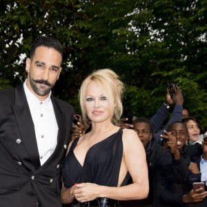 Adil Rami et Pamela Anderson arrivent à la 28ème cérémonie des trophées UNFP (Union nationale des footballeurs professionnels) au Pavillon d'Armenonville à Paris, France, le 19 mai 2019. 