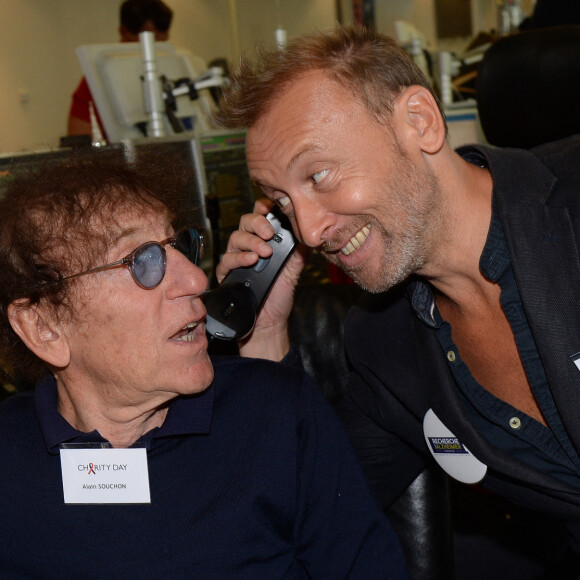 Alain Souchon et son fils Pierre lors de la 14ème édition du Charity Day dans la salle des marchés de la société de courtage Aure BGC au profit des 7 associations participantes à Paris; France, le 11 septembre 2018. © Veeren/Bestimage