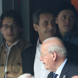 Nicolas Sarkozy avec ses fils Jean et Pierre Sarkozy au match d'ouverture de l'Euro 2016, France-Roumanie au Stade de France. © Cyril Moreau/Bestimage