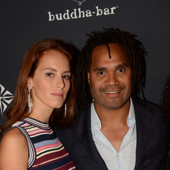 Christian Karembeu et sa femme Jackie Chamoun - A l'occasion des 20 ans de la victoire de l'équipe de France, les bleus 98 se sont rendus à un dîner organisé au Buddha Bar avec tous les joueurs et leur famille le 11 juin 2018. © Rachid Bellak/Bestimage 