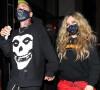 Avril Lavigne et son compagnon Mod Sun à la sortie du restaurant "Catch" à Los Angeles, le 19 février 2021.