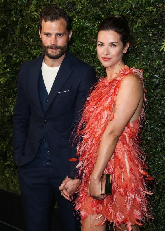 Jamie Dornan et sa femme Amelia Warner lors du dîner "Chanel and Charles Finch Pre-Oscar Awards" au restaurant Madeo à Los Angeles.