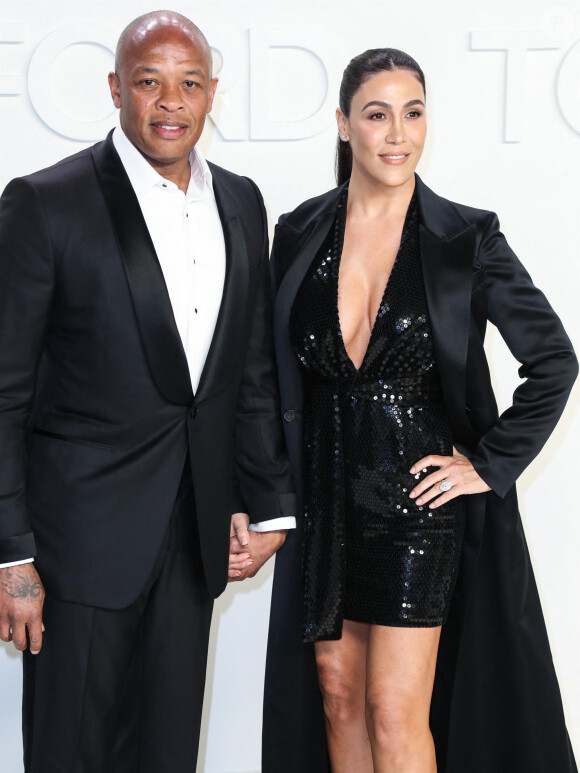 Dr. Dre et Nicole Young posent avant d'assister au défilé Tom Ford: Autumn/Winter 2020 aux Milk Studios dans le quartier de Hollywood à Los Angeles, le 7 février 2020.