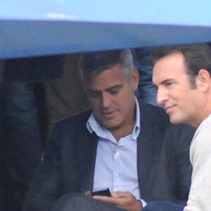 Semi-Exclusif – George Clooney et Jean Dujardin tournent la nouvelle publicité Nespresso à Cernobbio, le 28 août 2014.