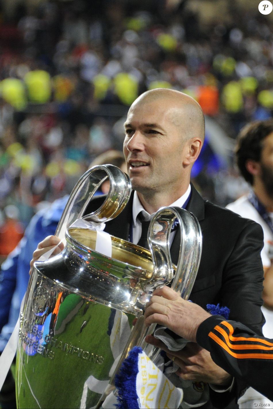 Zinédine Zidane fête la victoire du Real Madrid en Ligue des Champions après la finale face à l'Atletico Madrid. Lisbonne, le 24 mai 2014.