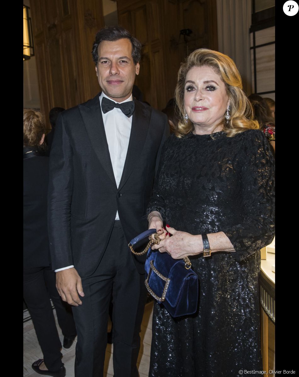 Laurent Lafitte et Catherine Deneuve - Soirée de cocktail Boucheron Place Vendôme lors de la fashion week à Paris, le 20 janvier 2019. © Olivier Borde/Bestimage
