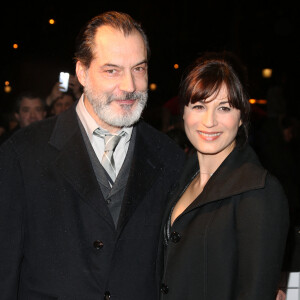 Samuel Labarthe et sa femme Helene Medigue arrivent à l'avant-première du film 'The Monuments men' à l'UGC Normandie sur les Champs-Elysées à Paris le 12 Février 2014.