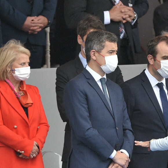La Première Dame Brigitte Macron et Gérald Darmanin, ministre de l'Intérieur lors de la cérémonie du 14 juillet sur la place de la Concorde à Paris, France, le 14 juillet 2021. © Eliot Blondet/Pool/Bestimage