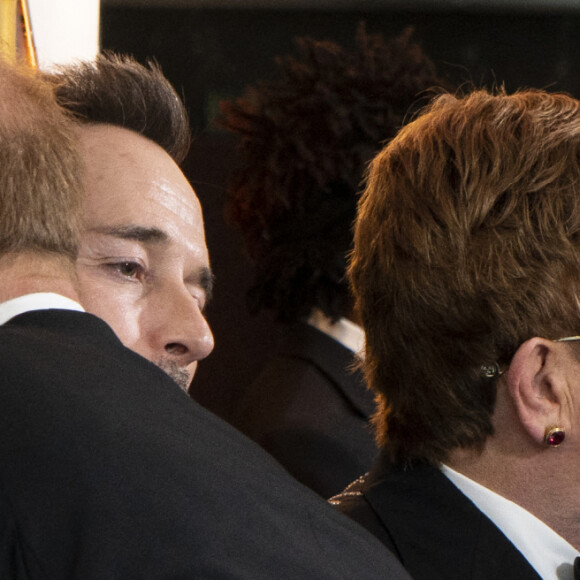 Le prince Harry, duc de Sussex, et Meghan Markle, duchesse de Sussex, avec Elton John et son mari David Furnish à la première du film "Le Roi Lion" au cinéma Odeon Luxe Leicester Square à Londres, le 14 juillet 2019.