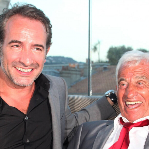 Jean Dujardin, Jean-Paul Belmondo - Soirée de Gala caritative au profit de l'association "Des Cantines Scolaires pour les Enfants du Sahel" à Cannes au Five Seas Hotel, le 31 mai 2014.