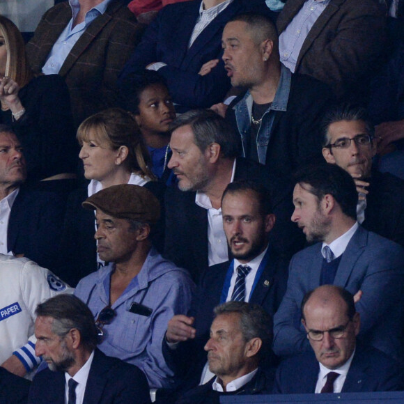 Maëva Coucke, Yannick Noah et son fils Joalukas, Nicolas Sarkozy et le Premier Ministre Jean Castex assistent au match de football opposant le PSG à l'Olympique Lyonnais au Parc des Princes. Paris, le 19 septembre 2021.