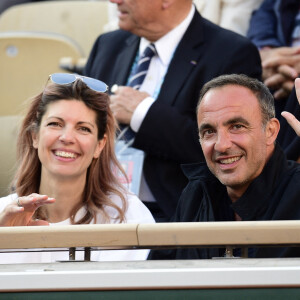 Nikos Aliagas et sa femme Tina dans les tribunes lors des internationaux de tennis de Roland Garros à Paris, France, le 31 mai 2019. © Jean-Baptiste Autissier/Panoramic/Bestimage 