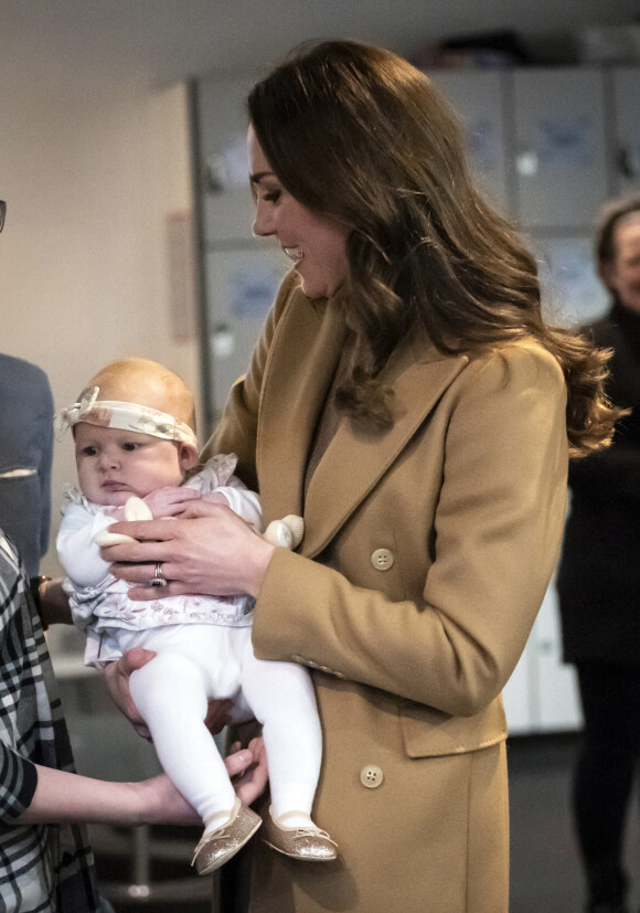 Le prince William, duc de Cambridge, et Catherine (Kate) Middleton, duchesse de Cambridge, rencontrent des bénévoles de l'Eglise "Church on The Street" à Burnley, le 20 janvier 2022. 