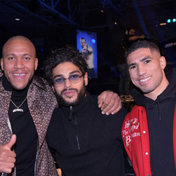 Exclusif - Franck Gastambide, Ciryl Gane, Achraf Hakimi (arrière droit au Paris Saint-Germain) - Gala de MMA ARES FC 2 au Palais des Sports Marcel Cerdan à Levallois-Perret le 11 décembre 2021. © Rachid Bellak/Bestimage