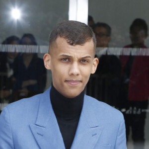 Le chanteur Stromae - Sorties du défilé de mode "Louis Vuitton", collection prêt-à-porter automne-hiver 2015/2016 à la fondation Louis Vuitton à Paris. Le 11 mars 2015 