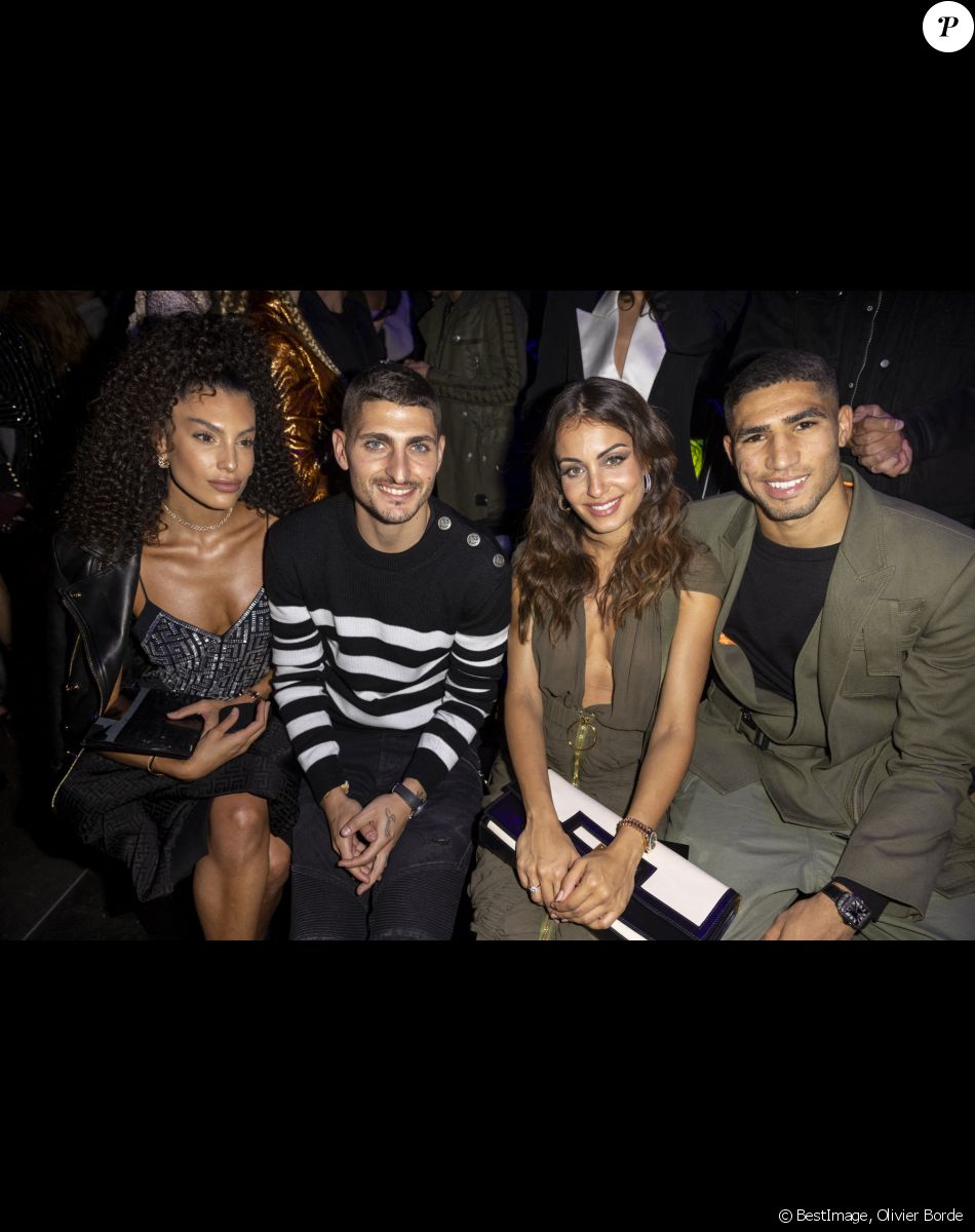 Marco Verratti et sa femme Jessica Aidi, Achraf Hakimi et sa compagne Hiba Abouk - People au défilé de mode Femmes prêt-à-porter printemps-été 2022 "Balmain" à la Seine Musicale à Paris. Le 29 septembre 2021 © Olivier Borde / Bestimage