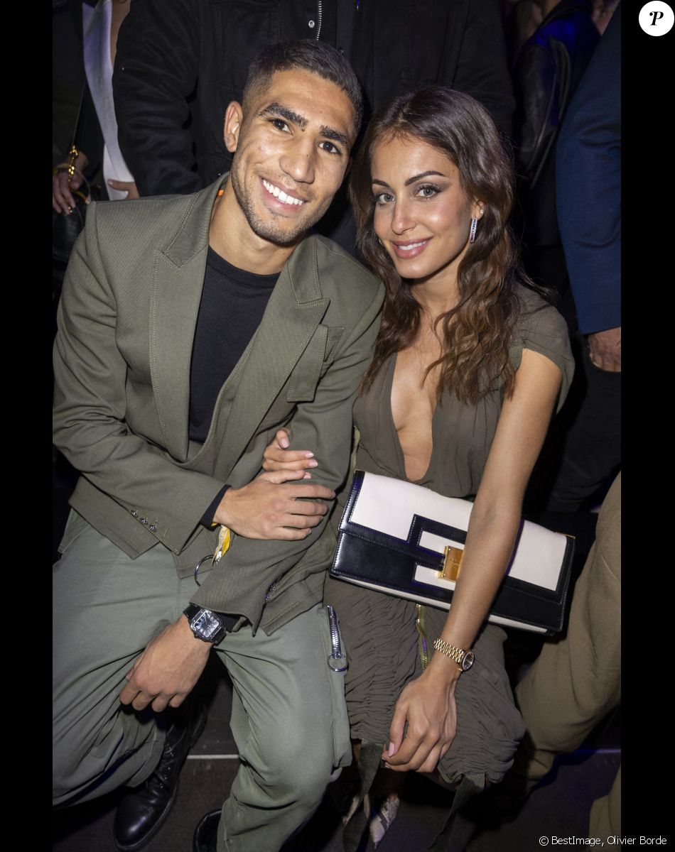 Achraf Hakimi et sa compagne Hiba Abouk - People au défilé de mode Femmes prêt-à-porter printemps-été 2022 "Balmain" à la Seine Musicale à Paris. Le 29 septembre 2021 © Olivier Borde / Bestimage