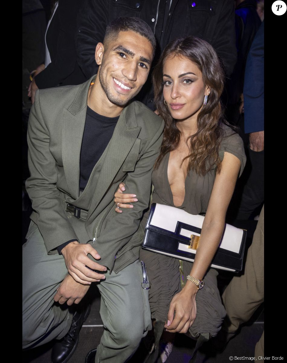 Achraf Hakimi et sa compagne Hiba Abouk - People au défilé de mode Femmes prêt-à-porter printemps-été "Balmain" à la Seine Musicale à Paris. © Olivier Borde / Bestimage