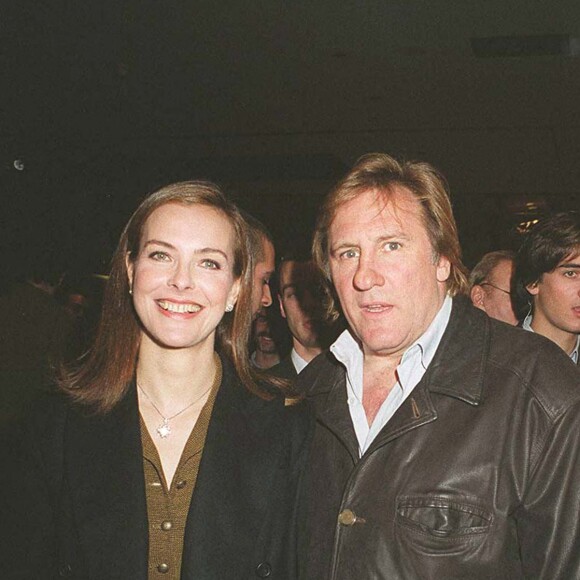 Carole Bouquet et Gérard Depardieu au défilé Chanel en 2001 à Paris