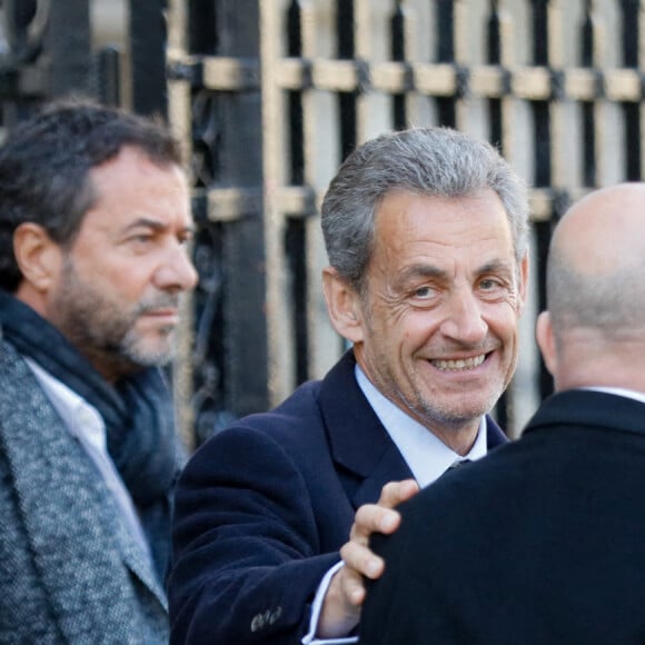 Bernard Montiel, Nicolas Sarkozy, Eric Ciotti, Carla Bruni - Sorties des obsèques de Jean-Pierre Pernaut en la Basilique Sainte-Clotilde à Paris le 9 mars 2022. © Christophe Clovis / Bestimage