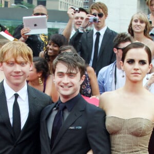 Rupert Grint, Daniel Radcliffe et Emma Watson à la première du film "Harry Potter et les Reliques de la mort : partie 2" à New York, en 2011.