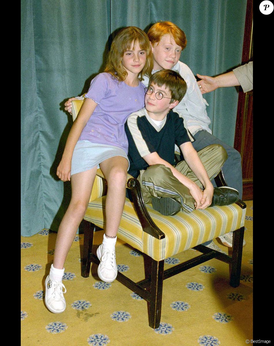 Rupert Grint, Daniel Radcliffe et Emma Watson lors de la conférence de presse du premier film Harry Pottter à Londres, en 2000.