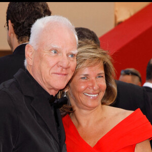 MALCOLM MCDOWELL, IRIS KNOBLOCH - MONTEE DES MARCHES DU FILM "LA PIEL QUE HABITO" - 64 EME FESTIVAL INTERNATIONAL DU FILM DE CANNES  RED CARPET FOR MOVIE "LA PIEL QUI HABITO" - 64 TH INTERNATIONAL CANNES FILM FESTIVAL 