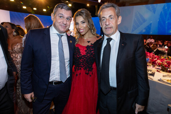 Exclusif - Bertrand Vidal, Houda Hammoucha et Nicolas Sarkozy - Dîner gala de l'association "Children of Africa" à Abidjan, le 11 mars 2022. © Olivier Borde / Bestimage