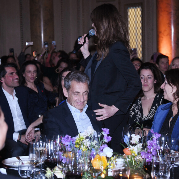 Exclusif - Nicolas Sarkozy et sa femme Carla Bruni-Sarkozy - Dîner des "Femmes Culottées" Etam au Musée de la Monnaie à Paris le 22 mars 2022. © Rachid Bellak/Bestimage 