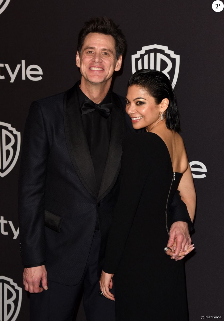 Jim Carrey et sa compagne Ginger Gonzaga Photocall de la soirée Warner InStyle Golden Globes