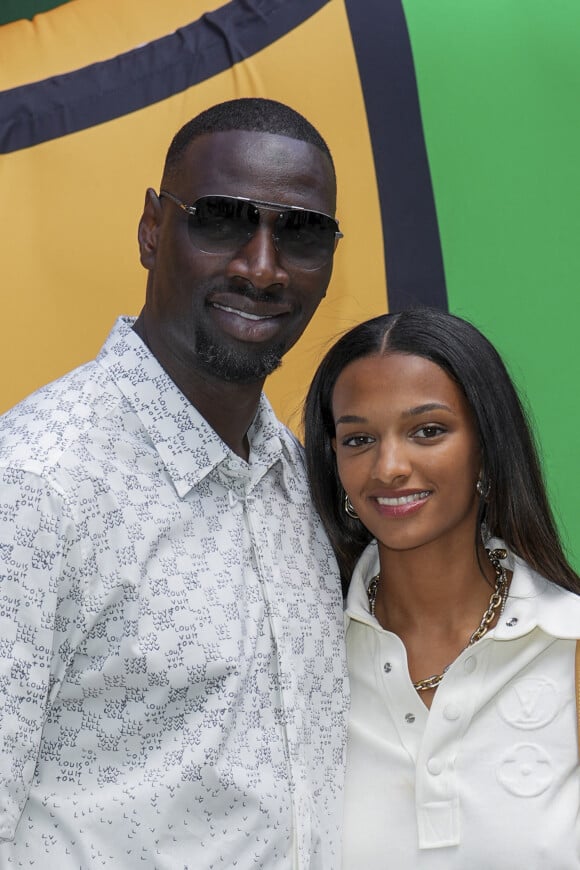 Omar Sy et sa fille Selly lors du défilé de mode Homme printemps-été 2023 Louis Vuitton dans la cour Carrée du Louvre à Paris, France, le 23 juin 2022. © Olivier Borde / Bestimage 