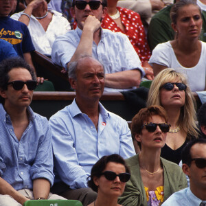 Michel Berger, guest et France Gall dans les tribunes des internationaux de Roland Garros en mai 1992