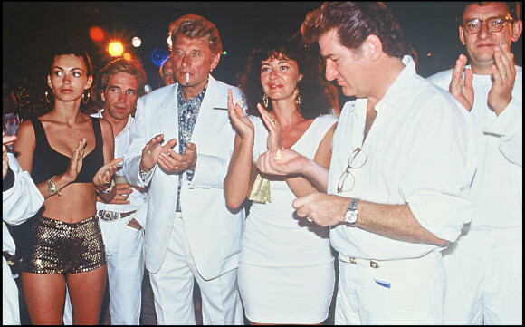 Eddy Mitchell avec Johnny Hallyday et Adeline Blondieau à Saint-Tropez pour le mariage d'Eddie Barclay