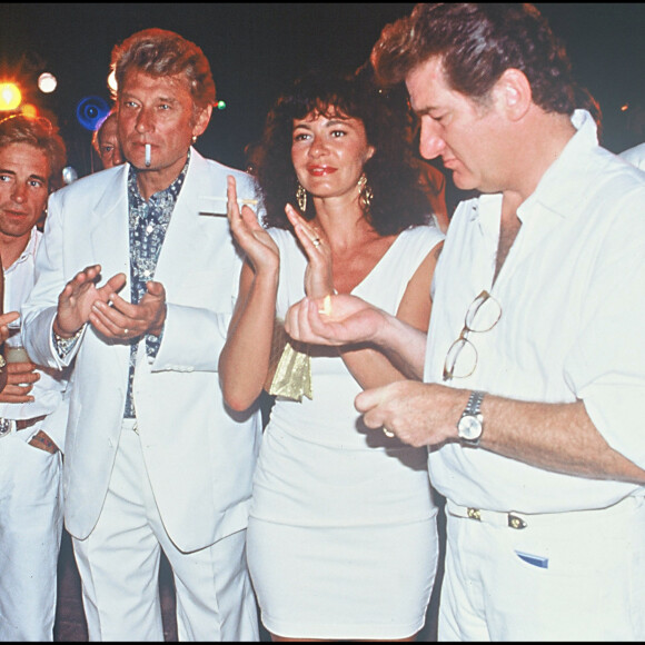 Eddy Mitchell avec Johnny Hallyday et Adeline Blondieau à Saint-Tropez pour le mariage d'Eddie Barclay